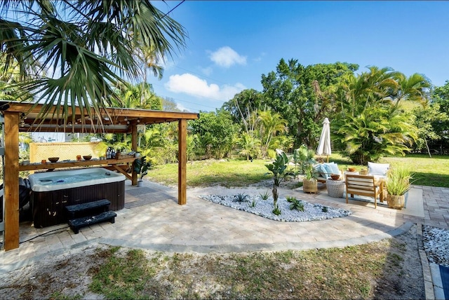 view of patio with a hot tub and an outdoor hangout area