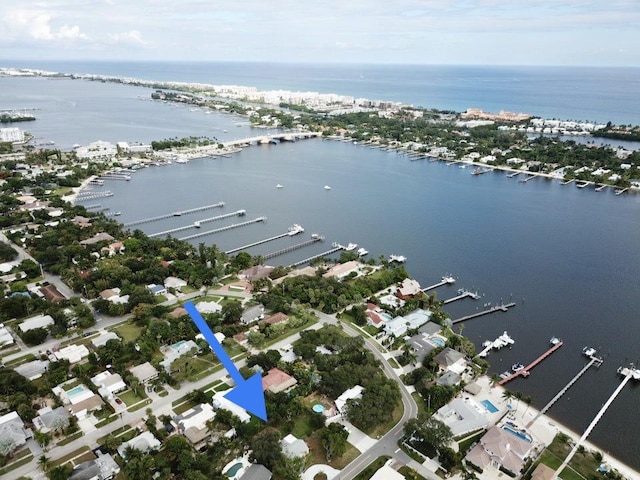 aerial view featuring a residential view and a water view