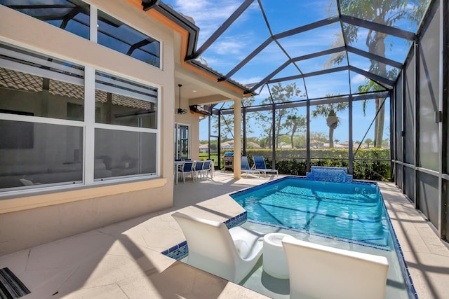 outdoor pool with a patio area and a lanai