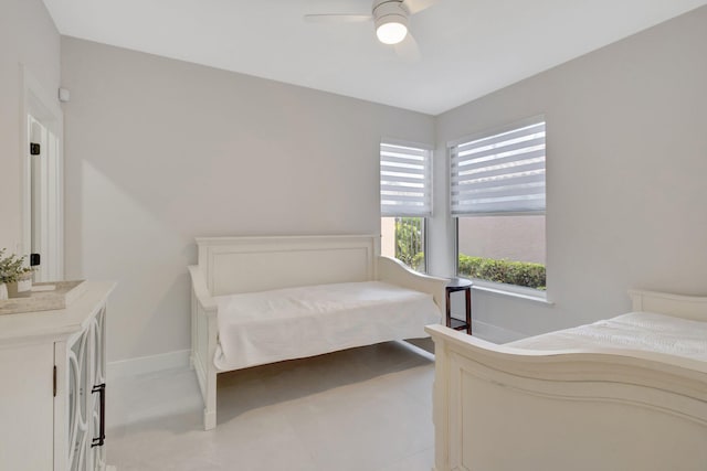 bedroom featuring baseboards and a ceiling fan