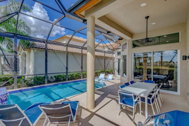 pool featuring a lanai and a patio area