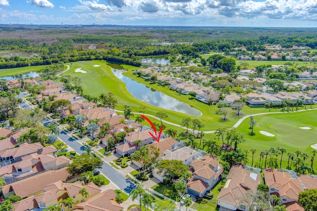 birds eye view of property with a residential view, a water view, and golf course view