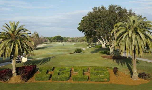 view of home's community with a yard