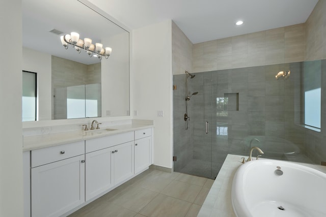 bathroom with a stall shower, visible vents, a garden tub, tile patterned flooring, and vanity