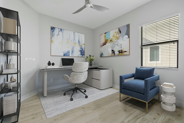 office featuring ceiling fan, wood finished floors, and baseboards