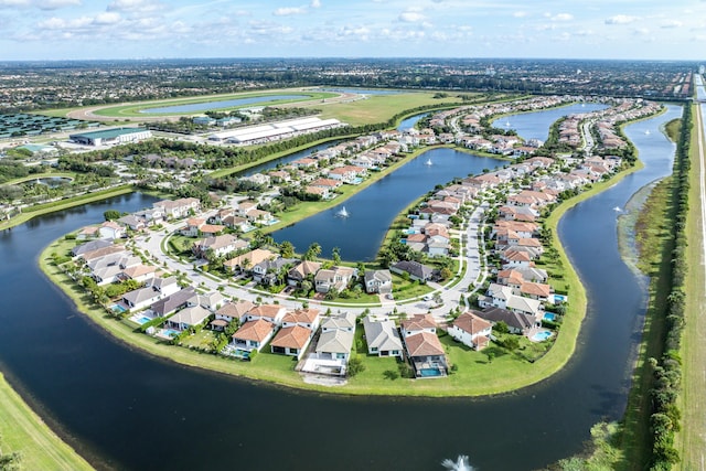 drone / aerial view with a water view and a residential view