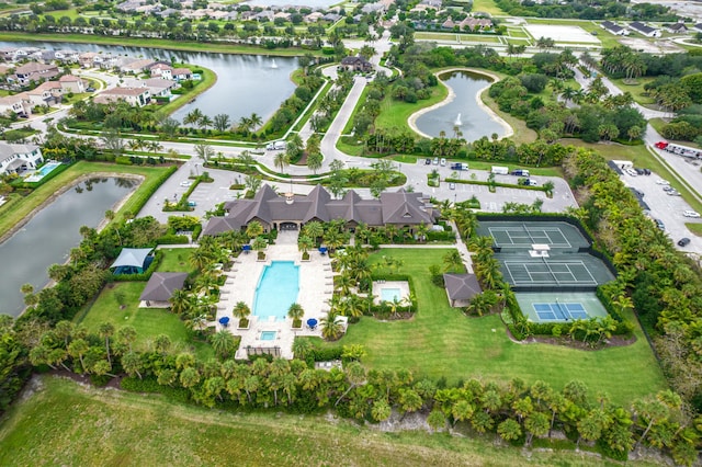 drone / aerial view with a residential view and a water view