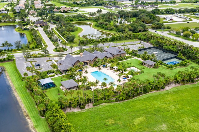 birds eye view of property with a water view and a residential view