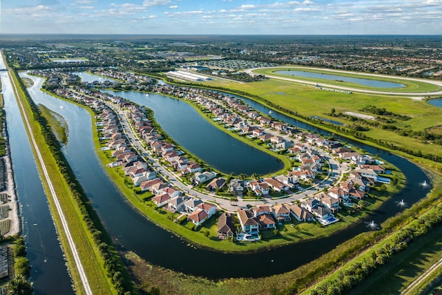 birds eye view of property with a residential view and a water view