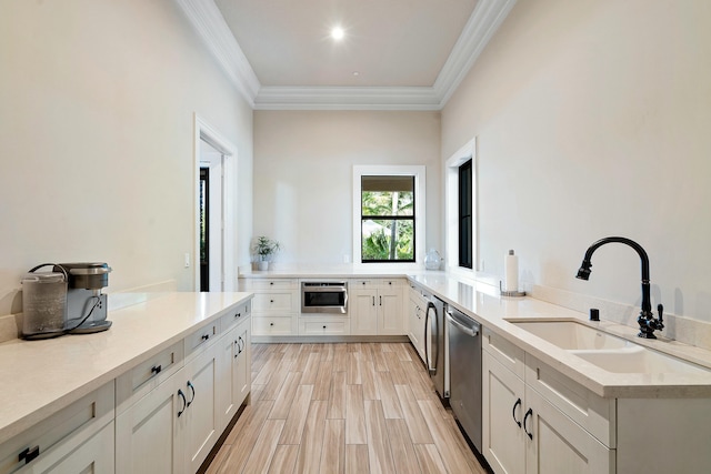 kitchen featuring oven, a sink, light countertops, stainless steel dishwasher, and wood tiled floor