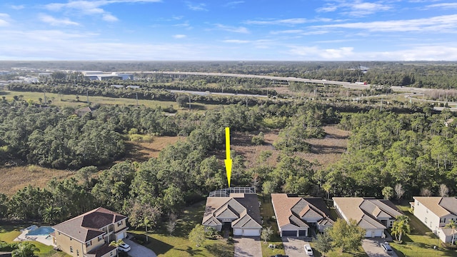 aerial view with a forest view and a residential view