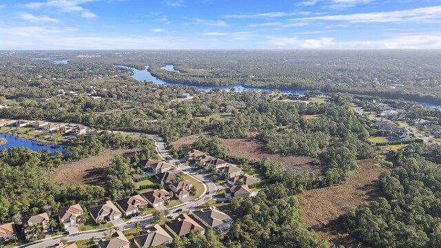 birds eye view of property with a residential view and a water view