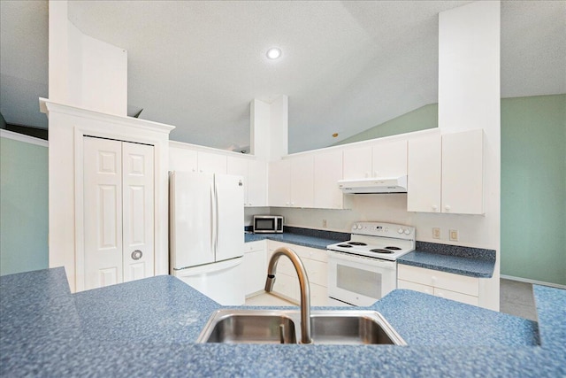 kitchen featuring white cabinetry, vaulted ceiling, a sink, white appliances, and under cabinet range hood