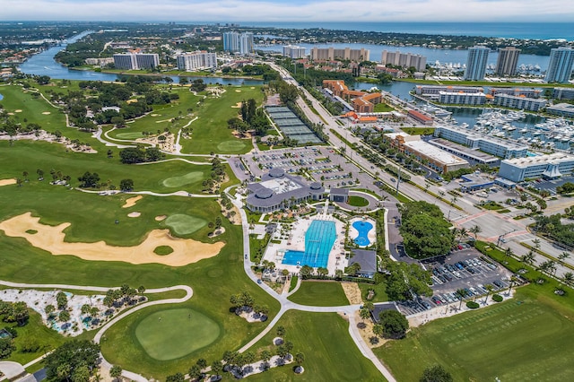 bird's eye view with a view of city, view of golf course, and a water view