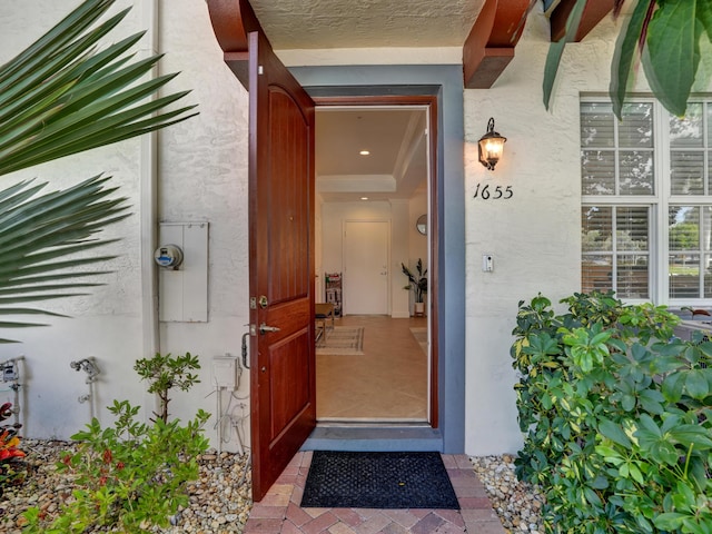 property entrance featuring stucco siding