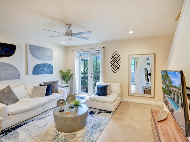 tiled living room with recessed lighting, french doors, ceiling fan, and baseboards