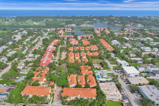 birds eye view of property with a water view and a residential view