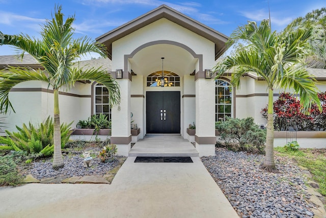 property entrance featuring stucco siding