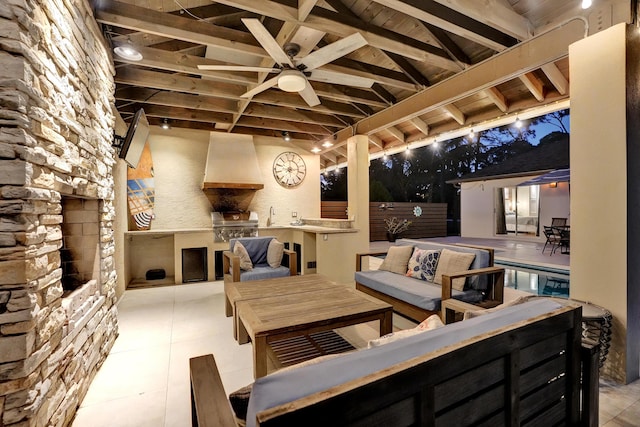 view of patio with an outdoor kitchen, a ceiling fan, grilling area, outdoor lounge area, and a sink