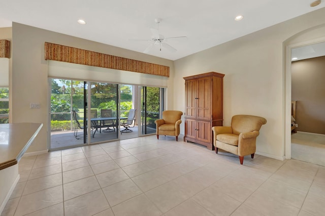 living area featuring a ceiling fan, recessed lighting, baseboards, and light tile patterned floors