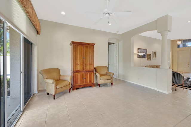 sitting room featuring decorative columns, baseboards, ceiling fan, and recessed lighting