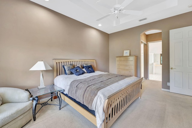 bedroom featuring arched walkways, recessed lighting, visible vents, light carpet, and ceiling fan