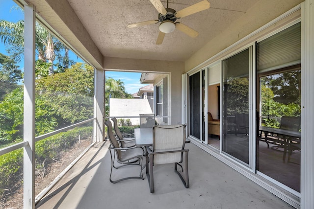 sunroom with a ceiling fan