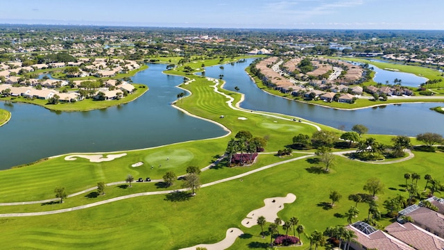 bird's eye view with a water view, a residential view, and golf course view