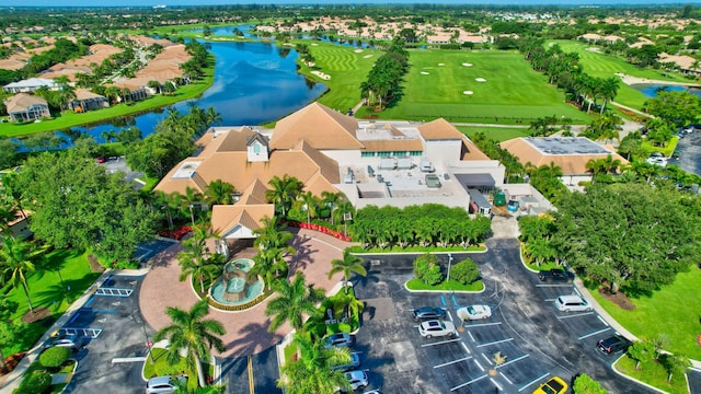 drone / aerial view featuring a residential view and a water view