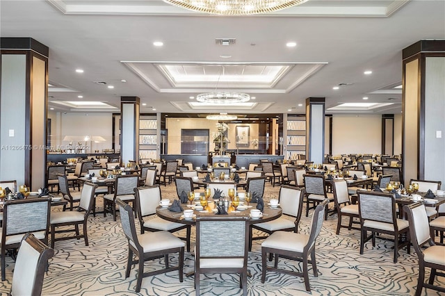 dining room featuring visible vents, a raised ceiling, crown molding, a notable chandelier, and recessed lighting