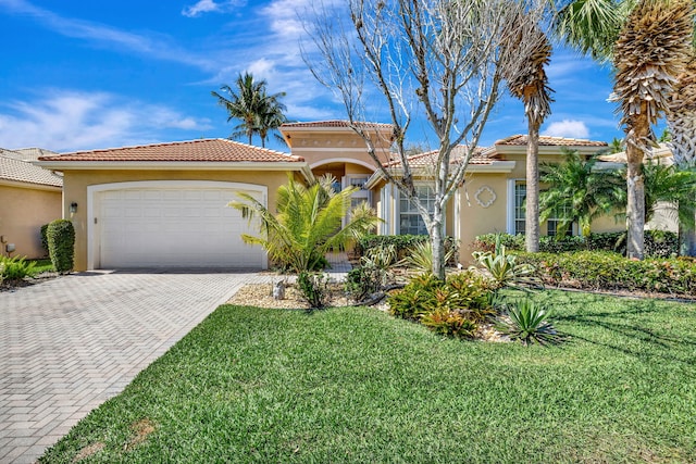 view of front of house with decorative driveway, an attached garage, a front yard, and stucco siding