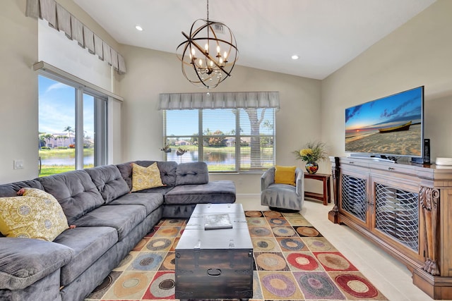 living area with a healthy amount of sunlight, a water view, vaulted ceiling, and recessed lighting