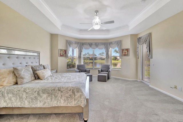 bedroom with crown molding, baseboards, a raised ceiling, and light colored carpet