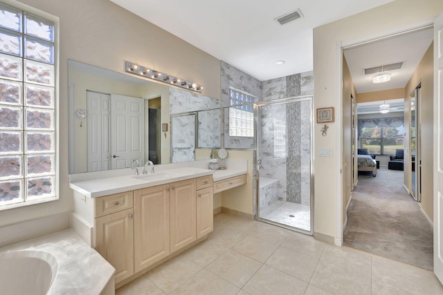 full bath with visible vents, a shower stall, ensuite bath, and vanity