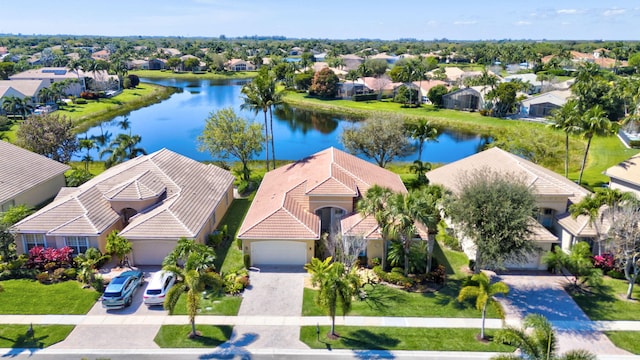 aerial view featuring a water view and a residential view