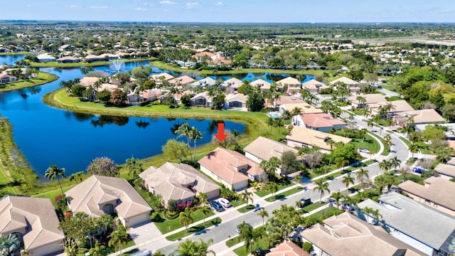 birds eye view of property featuring a residential view and a water view