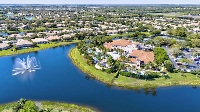 birds eye view of property with a water view and a residential view