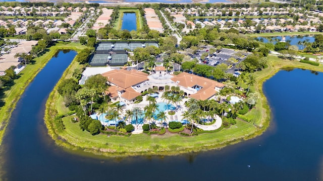 drone / aerial view with a water view and a residential view