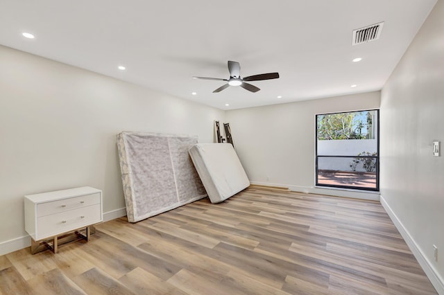 unfurnished bedroom with visible vents, recessed lighting, light wood-type flooring, and baseboards