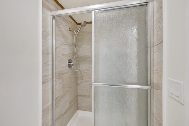 full bath with a shower stall