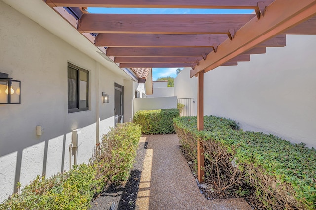 view of patio / terrace with a pergola and fence