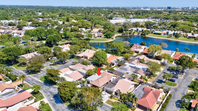 birds eye view of property with a residential view and a water view