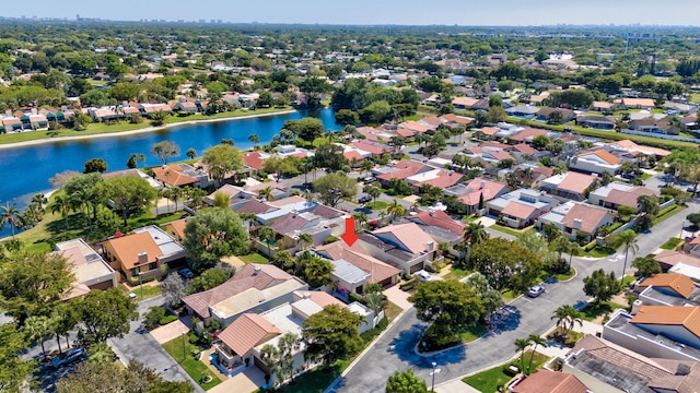 birds eye view of property with a residential view and a water view