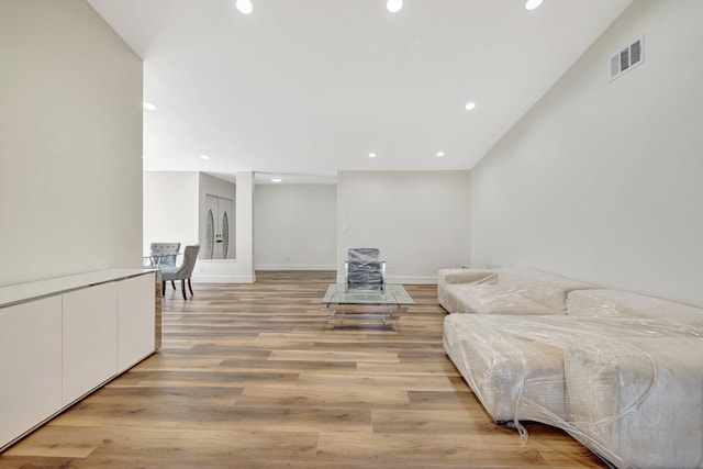 sitting room with recessed lighting, light wood-style floors, visible vents, and baseboards