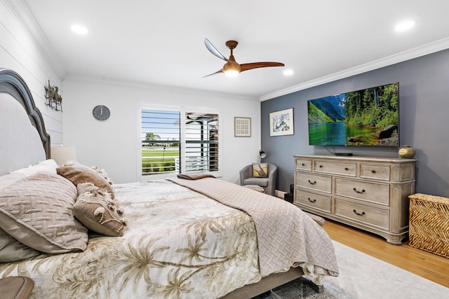 bedroom featuring light wood-style flooring, crown molding, and recessed lighting