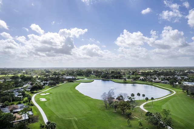 bird's eye view with view of golf course and a water view