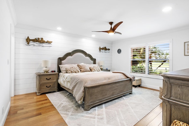 bedroom with crown molding, recessed lighting, light wood-style floors, ceiling fan, and baseboards