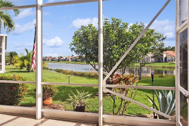 unfurnished sunroom with a water view