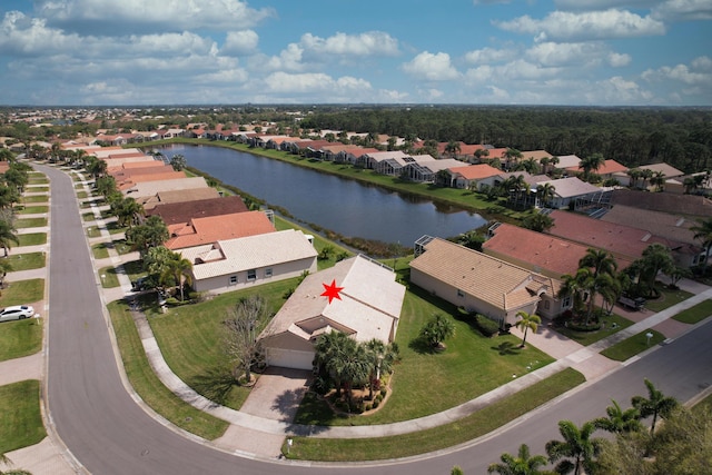 aerial view with a residential view and a water view