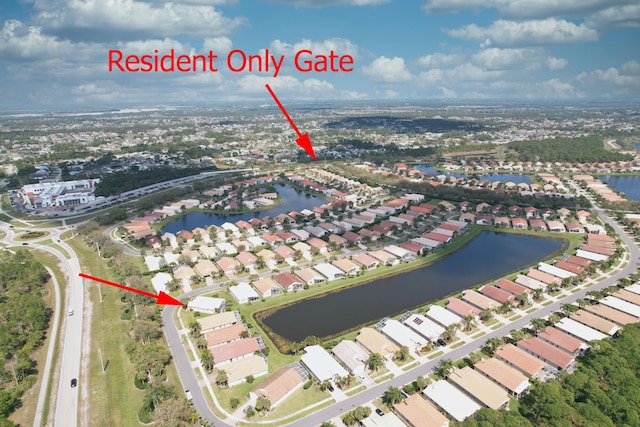 bird's eye view featuring a residential view and a water view